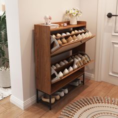 there is a shoe rack with many pairs of shoes on it