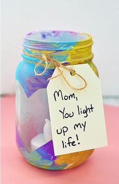 a jar with a note attached to it sitting on a table