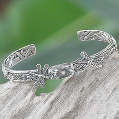 By Kadek Hendra, this beautiful bracelet depicts the dragonflies of summer. The delicate creatures take wing in sterling silver on a handcrafted bracelet. A 3.5-carat faceted prasiolite centers the beautiful cuff. The inside surface of the bracelet features a wonderfully-detailed bamboo motif. Dragonfly Bracelet, Mabe Pearl, Snake Earrings, Handcrafted Bracelets, Freshwater Cultured Pearls, Balinese, Dragonflies, Jewelry Packaging, Hook Earrings