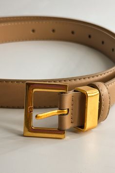 Front close up view of the Iris Taupe Slim Square Buckle Belt which features taupe Leather Fabric  and Gold Square Adjustable Buckle Adjustable Formal Belt With Buckle Closure, Formal Adjustable Belts With Buckle Closure, Adjustable Belt With Buckle Closure For Formal Wear, Chic Belts With Buckle Closure For Work, Chic Belts For Work With Buckle Closure, Gold Belts With Buckle Closure For Business, Elegant Formal Belt With Rectangular Buckle, Trendy Adjustable Belt For Formal Occasions, Trendy Adjustable Formal Belt