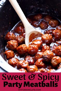 the meatballs are being cooked in the crock pot with a wooden spoon and is ready to be eaten