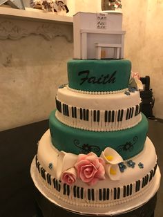 a multi layer cake decorated with piano keys and flowers