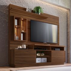 an entertainment center with a flat screen tv mounted on it's side, in a living room