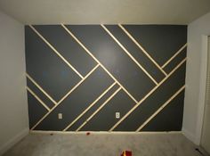 an empty room with some tape on the wall