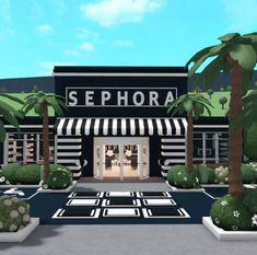 an image of a store front with palm trees in the foreground and landscaping around it