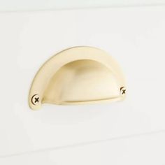 a close up of a door handle on a white wall