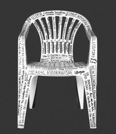 a white plastic chair with words written all over it