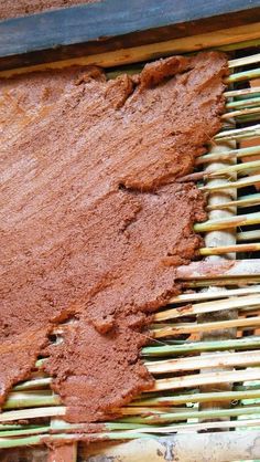 a piece of wood that has been cut in half and is being used as a bamboo screen