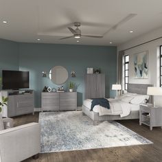 a bedroom with blue walls and white furniture in the corner, along with a gray rug