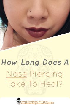 a woman holding up a sign that says how long does a nose piercing take to heal?