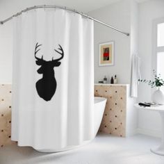 a bathroom with a shower curtain that has a deer's head drawn on it