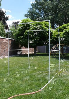 an outdoor soccer goal in the yard with numbers on it and measurements for each goal