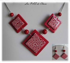 a red and white necklace with matching earrings