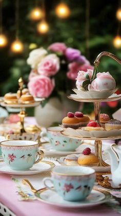 a table topped with plates and cups filled with desserts