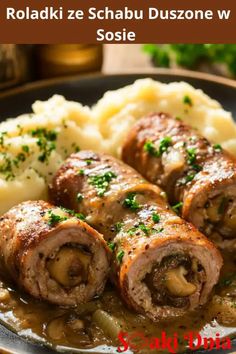 rolls and mashed potatoes on a plate with gravy