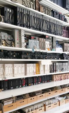 the shelves are filled with many different types of electronics and other electronic equipment in boxes