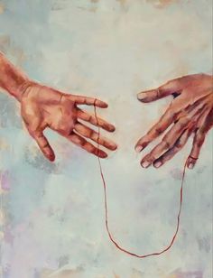 two hands reaching out to each other over a string