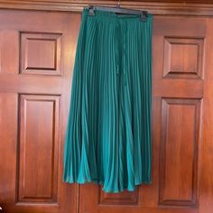 New With Tags Pleated Wide Leg Pants. Gives The Illusion Of A Skirt, But These Are Wide Leg Palazzo Pants. Waist Is Elastic With A Drawstring. Waste Is Measuring Approximately Unstretched 14 Inches. Pamts Measure Approximately 35 Inches Long. Green Pleated Bottoms For Spring, Spring Green Pleated Bottoms, Stretch Pleated Midi Skirt, Elegant Green Bottoms For Spring, Chic Green Long Skirt, Elegant Green Pleated Skirt, Elegant Green Spring Bottoms, Summer Trousers With Pleated Waist, Summer Pleated Bottoms For Night Out