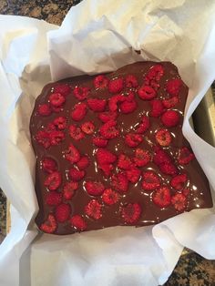 a piece of chocolate cake with raspberries on top