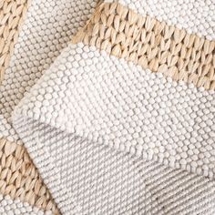 closeup of woven material with natural wood grains on the bottom and white fabric in the middle