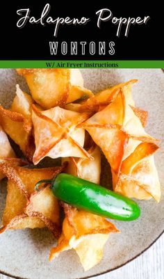 an image of wontons with jalapeno popper on the side