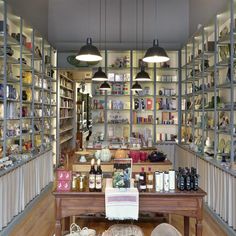 the inside of a store with lots of shelves