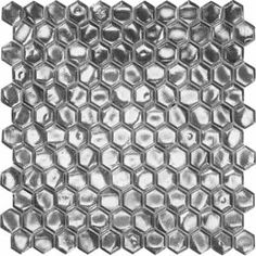 a black and white photo of hexagonal tiles with silver foil on the edges