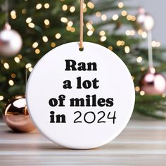 a ceramic ornament that says ran a lot of miles in 2014