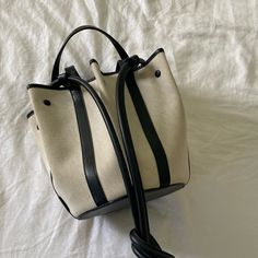 Canvas Bucket Bag From Vasic New York. Bag Can Be Buttoned Two Ways Refer To First And Last Pic. Excellent Conditions, Like New. Bag Also Has Long Strap To Wear On Shoulder. Canvas Bucket Bag, White Bag, New Bag, Womens Tote Bags, Bucket Bag, Black Color, White Black, White And Black, Like New