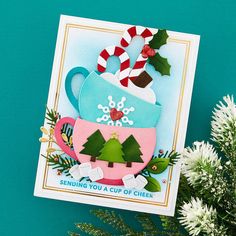 a handmade christmas card with a cup of cheer