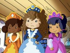 three children in princess dresses standing next to each other