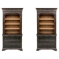 an old fashioned bookcase with two open shelves on one side and another closed shelf on the other