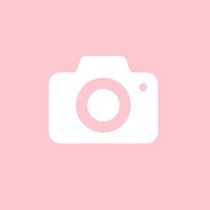 an image of a pink background with a camera in the foreground and a white square on the bottom right corner