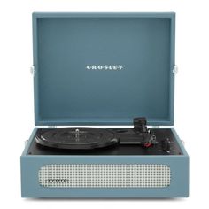 the crosley record player is shown in its blue case with an open lid