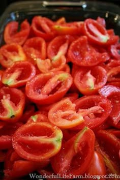 sliced tomatoes in a baking dish ready to be cooked and put on the stove top