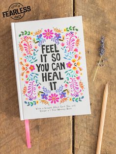 a book with the words feel it so you can heal it written in floral designs