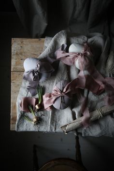 an arrangement of ribbons and flowers on a table