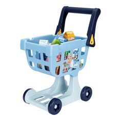 a toy shopping cart with various items in the front and sides on wheels, sitting upright against a white background