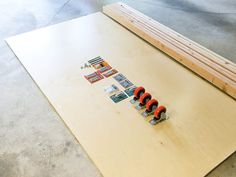 several pieces of wood sitting on top of a table with magnets attached to them