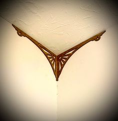 the corner of a wall with a clock on it