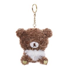 a brown teddy bear keychain hanging from a chain