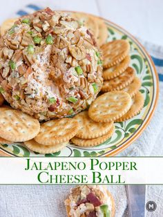 there is a plate with crackers and cheese ball on it, along with the words jalapeno popper cheese ball