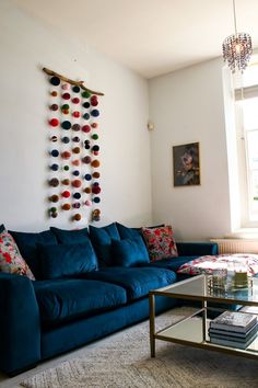 a living room with a blue couch and coffee table