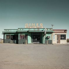 an old diner sits empty in the middle of nowhere