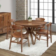 a wooden table with four chairs around it