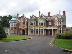 a large building with lots of windows on the front and side of it's sides