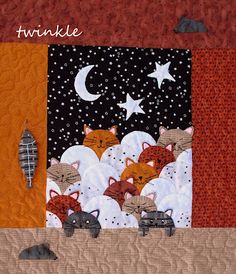 a quilted wall hanging with cats sleeping on it's sides and stars in the sky