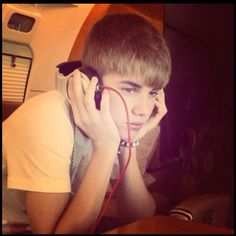 a young boy listening to music with headphones