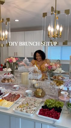 a woman standing in front of a table filled with food