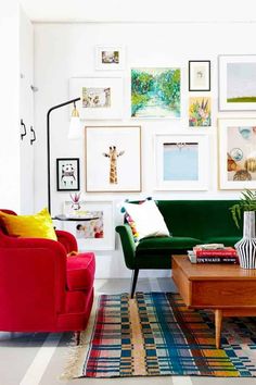 a living room filled with furniture and lots of pictures on the wall above it's coffee table